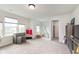 Bright bonus room features large windows, playful decor, and plenty of space for children to play at 12988 Fernie Cir, Fishers, IN 46037