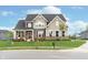 Charming two-story home with brick and siding, well-manicured lawn and mature trees at 12988 Fernie Cir, Fishers, IN 46037