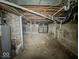 Unfinished basement shows concrete floors and walls ready to be transformed into extra living space at 1351 S Belmont Ave, Indianapolis, IN 46221