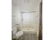 Accessible bathroom featuring a spacious walk-in shower and safety bars, designed for comfort and ease of use at 1351 S Belmont Ave, Indianapolis, IN 46221