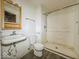 Functional bathroom with a walk-in shower and classic fixtures, providing a clean and efficient space at 1351 S Belmont Ave, Indianapolis, IN 46221