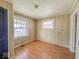 Cozy bedroom with natural light from two windows at 1351 S Belmont Ave, Indianapolis, IN 46221