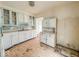Cozy kitchen features classic cabinets and a functional layout at 1351 S Belmont Ave, Indianapolis, IN 46221