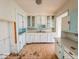 Cozy kitchen features classic cabinets and a functional layout at 1351 S Belmont Ave, Indianapolis, IN 46221