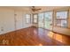 Bright living room with large windows and hardwood floors at 1351 S Belmont Ave, Indianapolis, IN 46221