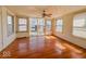 Bright living room with large windows and hardwood floors at 1351 S Belmont Ave, Indianapolis, IN 46221