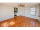 Bright living room with large windows and hardwood floors at 1351 S Belmont Ave, Indianapolis, IN 46221