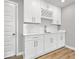 Modern kitchen with white cabinets, stylish fixtures, and ample counter space at 13833 Tender Dr, Carmel, IN 46032