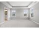 Bright, spacious main bedroom with a trey ceiling and access to the ensuite bathroom at 13833 Tender Dr, Carmel, IN 46032
