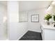 Modern bathroom featuring dual sinks, white cabinets, and a stylish glass-enclosed shower at 14477 Stairbridge Pl, Carmel, IN 46032