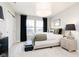 Cozy bedroom with a comfortable bed, stylish lighting, and large windows at 14477 Stairbridge Pl, Carmel, IN 46032