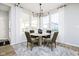 Cozy breakfast nook with a round table, seating for four, and bright natural light from surrounding windows at 14477 Stairbridge Pl, Carmel, IN 46032