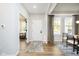 Bright entryway featuring hardwood floors, a neutral color palette, and an inviting view into other rooms at 14477 Stairbridge Pl, Carmel, IN 46032