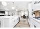 Open concept kitchen with stainless steel appliances, large island, and breakfast nook at 14477 Stairbridge Pl, Carmel, IN 46032