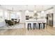 Bright kitchen and eating area with stainless appliances, island, and an open floorplan at 14477 Stairbridge Pl, Carmel, IN 46032