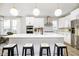 Bright kitchen featuring a large island with seating, stainless steel appliances, and stylish pendant lights at 14477 Stairbridge Pl, Carmel, IN 46032