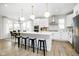 Spacious kitchen with a center island, stainless steel appliances, and pendant lighting over breakfast bar at 14477 Stairbridge Pl, Carmel, IN 46032