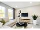 Cozy living room with modern decor, large windows, and stylish furniture at 14477 Stairbridge Pl, Carmel, IN 46032