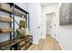 Mud room with shelving and hooks for storage, with door leading to closet at 14477 Stairbridge Pl, Carmel, IN 46032