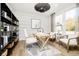 Well-lit home office with modern decor, a comfortable workspace, and stylish shelving for organization at 14477 Stairbridge Pl, Carmel, IN 46032