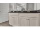 Bright bathroom featuring white cabinetry, chrome hardware, and a view outside at 15206 Swallow Falls Way, Fishers, IN 46037