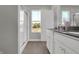 Bright bathroom with a double vanity, walk-in shower, and nature views at 15206 Swallow Falls Way, Fishers, IN 46037