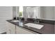 Double vanity with stone countertop and chrome faucets at 15206 Swallow Falls Way, Fishers, IN 46037