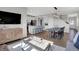 Spacious living room shows open floor plan, modern lighting, eat-in kitchen, stainless appliances, and lots of seating at 15206 Swallow Falls Way, Fishers, IN 46037