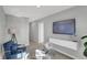 Comfortable loft area with modern furniture and a wall-mounted TV for entertainment at 15206 Swallow Falls Way, Fishers, IN 46037
