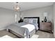 Serene primary bedroom featuring soft lighting, plush bedding, and stylish nightstands at 15206 Swallow Falls Way, Fishers, IN 46037