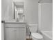 Bright bathroom featuring a white vanity, framed mirror, and modern toilet at 15214 Swallow Falls Way, Fishers, IN 46037