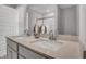 Bathroom featuring dual sinks, quartz countertop, and neutral color palette at 15214 Swallow Falls Way, Fishers, IN 46037