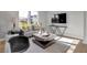 Bright living room with modern furnishings, hardwood floors and neutral paint at 15214 Swallow Falls Way, Fishers, IN 46037