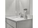 Close up on a bright bathroom vanity with white countertop, chrome faucet and candle at 15214 Swallow Falls Way, Fishers, IN 46037