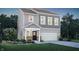 Charming two-story home with gray siding, a welcoming porch, and an attached two-car garage at 15294 Swallow Falls Way, Fishers, IN 46037