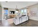 Bright living room featuring neutral decor, modern lighting, plush seating, and large windows at 15294 Swallow Falls Way, Fishers, IN 46037