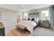 Spacious main bedroom with plush carpeting, bright windows, neutral decor, and stylish furniture at 15294 Swallow Falls Way, Fishers, IN 46037