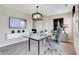 A modern office space with a glass desk, a flat-screen television, and sleek decor for a professional work environment at 15294 Swallow Falls Way, Fishers, IN 46037