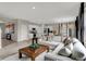 Spacious open concept living space with vinyl flooring, large windows and comfortable seating at 15310 Swallow Falls Way, Fishers, IN 46037