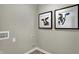 Laundry room area with black framed art of a cow on a light gray wall at 15310 Swallow Falls Way, Fishers, IN 46037
