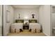' bedroom with two twin beds, themed wallpaper, and patterned accent rug at 15384 Cardonia Rd, Fishers, IN 46037