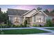 Charming home features a brick foundation, stylish siding, landscaped yard, and inviting entrance at 15384 Cardonia Rd, Fishers, IN 46037