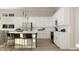 Spacious kitchen with white cabinets, stainless steel appliances, and an island with counter seating at 15384 Cardonia Rd, Fishers, IN 46037