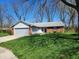 Charming single-story home with a well-maintained lawn and a two-car garage, perfect for a small Gathering at 1657 Park Terrace Ct, Indianapolis, IN 46229