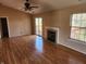Bright living room with wood-look flooring, a fireplace, and sliding glass doors to the deck, ideal for relaxing at 1657 Park Terrace Ct, Indianapolis, IN 46229