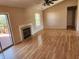 Inviting living room featuring a fireplace, wood-look flooring, and a sliding door leading to outdoor space, perfect for gatherings at 1657 Park Terrace Ct, Indianapolis, IN 46229