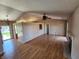 Open living room with wood-look flooring, a fireplace, and lots of natural light, great for entertaining at 1657 Park Terrace Ct, Indianapolis, IN 46229
