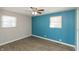 Bedroom featuring a large window for natural light and a ceiling fan at 1665 South Dr, Columbus, IN 47203