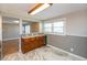 Kitchen view showcasing lots of cabinets and counterspace in a sunlit space at 1665 South Dr, Columbus, IN 47203