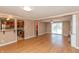 Open-concept living area with wood-look flooring, seamlessly connecting the kitchen and living spaces at 1665 South Dr, Columbus, IN 47203